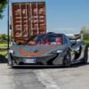 Horacio Pagani driving a Mclaren P1 supercar