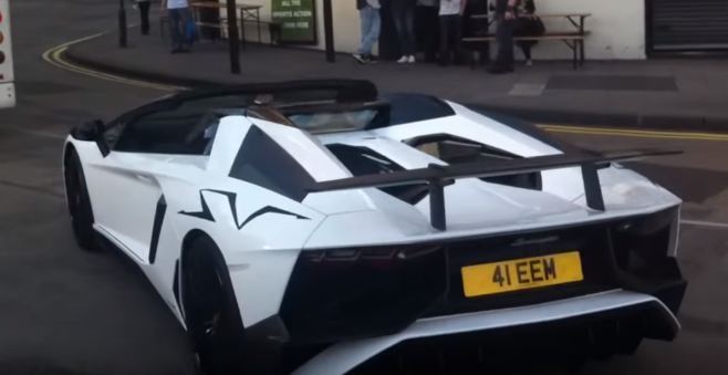Lord Aleem pulled over in Lamborghini Aventador SV Roadster